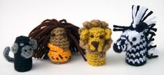 four crocheted animals are lined up in a row