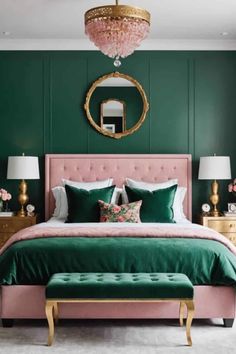 a bedroom with green walls, pink bedding and gold accents on the headboard