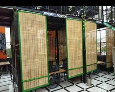 some sort of bamboo room divider in a building