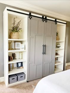 a bedroom with a bed, book shelf and closet