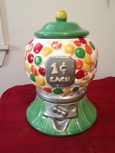 a gummy machine sitting on top of a red table