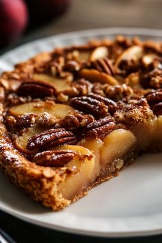 a slice of pecan pie on a white plate