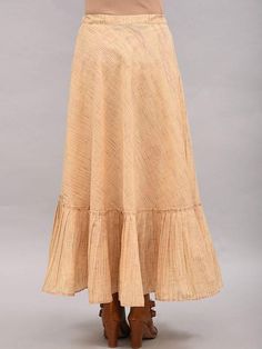 A full length beige tiered umbrella skirt with draw string at waist Ready garment measurements (in Inches): Free size: Length: 37", Waist - 39" Fabric: Cotton Dobby Color: Beige Fit: Model height is 5'7" Model is wearing a size S Loose and comfortable fit. Instructions: Hand wash separately in cold water This product will be shipped within 20-25 days of order placed. Cream Ruffled Long Skirt, Beige Pleated Tiered Skirt Bottoms, Beige Pleated Tiered Skirt, Cream Long Ruffled Skirt, Cream Pleated Tiered Skirt, Cotton Maxi Skirt With Ruffle Hem, Flowy Tiered Maxi Skirt In Cream, Beige Tiered Lined Maxi Skirt, Cream Flowy Tiered Maxi Skirt