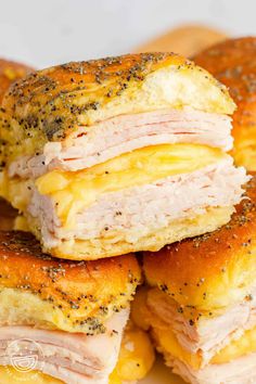 turkey sliders with cheese are stacked on top of each other and the title reads, turkey sliders with cheese