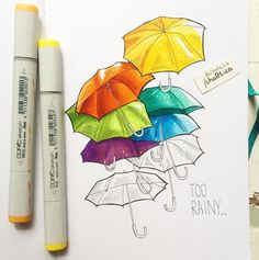 two markers are next to a drawing of umbrellas