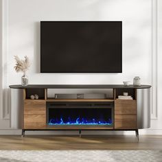 an entertainment center with a television and fireplace