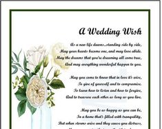 a wedding wish card with flowers in a vase