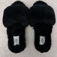 Ugg Brand New Black Fuzzy Slippers In Excellent Condition With No Damages Or Defects. Comes From A Smoke Free And Pet Free Home. Comfy Black Slip-on Slippers, Black Slip-on Winter Slippers, Comfortable Black Slippers, Black Cushioned Slippers For Winter, Black Flat Slippers For Winter, Black Flat Winter Slippers, Black Round Toe Slippers For Fall, Comfortable Black Slippers For Fall, Trendy Black Flat Slippers