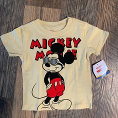 This Is A Brand New T-Shirt With Tag. Made Of 60% Cotton And 40% Polyester. Short Sleeves. Mickey Mouse Is On The Front With His Sunglasses On. Please Check Out My Closet For More Clothes, Shoes, Jewelry, Purses, Books And Much Much More!! Poshmark.Com/Closet/Katcars Ka673 Mickey Mouse Outfit, Mickey Mouse Shirt, Mickey Mouse Shirts, Yellow T Shirt, Disney Junior, Disney Shirts, Red Yellow, Kids Shirts, Tshirt Print