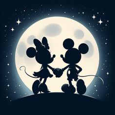 two mickey mouses holding hands in front of a full moon