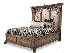 a bed with an ornate headboard and foot board on it's side,