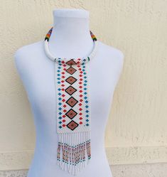 Tribal Beaded Necklace Southwestern White Beaded Necklaces For Festivals, White Southwestern Style Beaded Necklaces For Festival, Southwestern Style White Beaded Necklace With Large Beads, Southwestern Style White Beaded Necklace For Festivals, Southwestern Style Large White Beads, Bohemian Hand-strung Beaded Necklaces For Festivals, Traditional Ceremonial Beaded Necklaces With Colorful Beads, Traditional Ceremonial Beaded Necklaces For Festivals, Bohemian Multi-strand Beaded Bib Necklaces