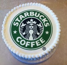 a starbucks cake with white frosting on a table