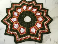 two crocheted coasters sitting on top of a white tile floor