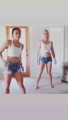 two women standing in a living room next to each other