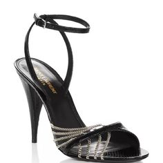 A Pair Of Woman’s Heels In A Black Leather With A Snake Skin Design And Chain Detailing. Size: 38 1/2, Fits True To Size Height: 4" Heel Material: Leather Upper, Lining And Sole Msrp: $1,195 Evening Sandals With 4-inch Heel, Luxury Ankle Strap Heels For Night Out, Luxury Evening Sandals With 4-inch Heel, Luxury Open Heel Heels For Dinner, Luxury High Heel Shoes For Night Out, Luxury Heels With Wrapped Heel For Night Out, Luxury High Heel For Night Out, Luxury High Heels For Night Out, Luxury 4-inch Heels For Evening