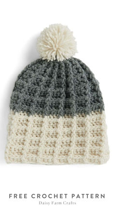 a crocheted hat with a pom - pom on top and the words free