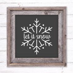 a framed snowflake with the words let it snow