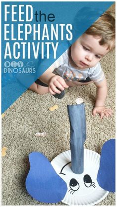 a toddler playing with a paper plate that has an elephant on it and the words feed the elephants activity