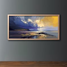 a painting hanging on the wall above a wooden table