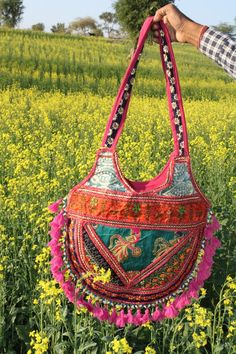 This is a handmade handcrafted very beautifull bag from barmer rajasthan india for multi purpose uses. Material:- -Cotton Cloths -Handmade items -Handmade designs -Embroidery -Embroided Front Usage Of Purpose:- -College -Market -Holidays Care Instructions:- -Wash it and dry it in the shade. Traditional Handmade Bags For Navratri, Handmade Multicolor Embroidered Shoulder Bag For Festivals, Handmade Shoulder Bag With Multicolor Embroidery For Festivals, Festival Shoulder Bag With Multicolor Embroidery And Motifs, Multicolor Rectangular Bag With Zari Work, Embroidered Shoulder Bag For Festivals, Multicolor Embroidery Bag With Zari Work For Festivals, Festival Rectangular Dori Work Shoulder Bag, Multicolor Embroidery Zari Work Bag For Festivals