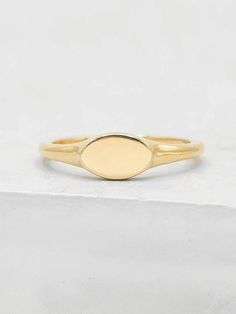 Signet rings are traditionally a symbol of family heritage, but has since then become a staple for gifting and personalization! Make a ring a lot more personal for yourself or for a friend and/or family member. This ring makes a perfect gift for graduations, anniversaries and as bridesmaids gifts! It's intentional is to create a sentimental connection with a date, person or anything else of importance to you! The ring is made of gold plated brass with an engravable surface measuring about 5x8mm. Classic Oval Stackable Signet Ring, Classic Engraved Brass Wedding Ring, Oval Yellow Gold Initial Ring, Symbolic Oval Engraved Adjustable Ring, Symbolic Adjustable Oval Engraved Ring, Symbolic Engraved Adjustable Oval Ring, Adjustable Oval Yellow Gold Initial Ring, Oval Stackable Signet Ring For Anniversary, Adjustable Oval Initial Ring In Yellow Gold