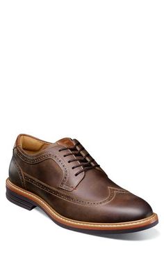 A fully cushioned insole and flexible sole ensure lasting comfort in this polished leather oxford featuring classic brogued detailing. Lace-up style Removable insole Leather upper/textile lining/rubber sole Imported Brown Wingtip Oxfords For Business Casual, Semi-formal Moc Toe Oxfords With Brogue Detailing, Low-top Oxfords With Brogue Detailing, Brown Oxfords With Cushioned Moc Toe, Semi-formal Moc Toe Oxford Lace-up Shoes, Semi-formal Oxford Lace-up Shoes With Moc Toe, Classic Brown Dress Shoes With Cushioned Footbed, Brown Moc Toe Oxfords With Cushioned Footbed, Wingtip Oxford Dress Shoes With Branded Insole