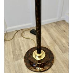 a lamp that is on top of a wooden floor