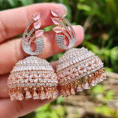 Glamorous intricate American Diamond CZ Jhumki/ Jhumka in silver and rose Gold Plated. These Jhumka Earrings have zircon all around. Perfect for every occasion. Pair them with your favorite outfit and Shine with this beauty. Weight: 23g each Drop lenth: 5.5cm approx width: 3cm dimeter Bridal Jewelry Indian, Diamond Earrings Indian, Earrings Outfit, Jewelry Pakistani, Fancy Jewellery Designs, Polki Necklace, Indian Jewellery Design Earrings, Jhumki Earrings, Bollywood Jewelry