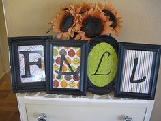 three frames with letters and sunflowers on top of a white dresser next to a wall