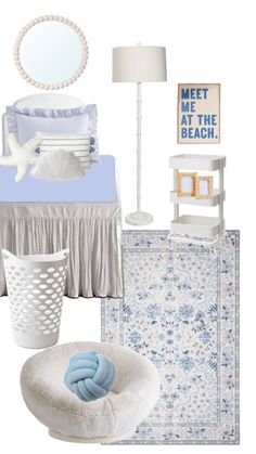 a bedroom with blue and white decor on the walls, bedding, rugs, table