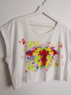 "One-of-a-kind reworked crop top, loose oversized fit, raw edges on neckline and bottom, rolled up sleeves. Item is reworked from an excellent quality cotton vintage oversized t-shirt, hand-painted by yours truly with water-based special textile colours. The print is inspired by the Rorschach's inkblot test, but less gloomy. The way the colours combine is totally arbitrary, no two designs will ever be the same. I see \"In Utero\". What do you see in this print? :) This crop top has already been Oversized White Crop Top For Spring, Oversized Cotton Crop Top For Spring, Oversized Cotton Cropped T-shirt For Summer, Oversized Cropped T-shirt For Spring, Oversized Cropped T-shirt For Summer, Oversized Cropped Top For Summer, Boxy Cropped Cotton Shirt For Spring, Summer Cotton Tops With Paint Splatter, Summer Cotton Top With Paint Splatter