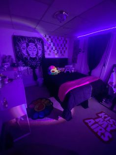 a bed room with a neatly made bed and purple lighting