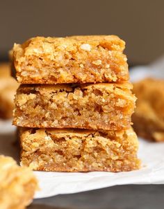 three pieces of food are stacked on top of each other in front of the camera