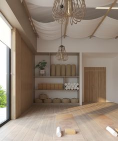 an empty room with wooden floors and shelves