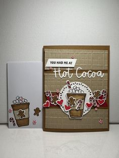 a close up of a greeting card on a table with two pieces of crafting paper