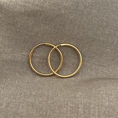 14 K Gold-Filled Hoops, Great For Everyday Use. Unisex Earrings. It Is Available In 14mm The Best Choice To Buy As A Gift For Yourself Or Your Loved Ones. These Earrings Are Great For Bridesmaids' Gifts. 14k Gold Filled Tarnish Resistant, 14mm, Continuous Hoop Earrings, 14k Gold Filled Endless Hoops, Gift Round Huggie Earrings, Classic Small Hoop Jewelry For Gifts, Classic Small Hoop Jewelry For Gift, Tarnish Resistant Round Huggie Earrings As Gift, Classic 14k Gold Filled Hoop Earrings For Anniversary, Yellow Gold Hoop Jewelry Gift, Yellow Gold Hoop Jewelry As Gift, Gift Yellow Gold Hoop Jewelry, Hypoallergenic Hoop Jewelry For Anniversary