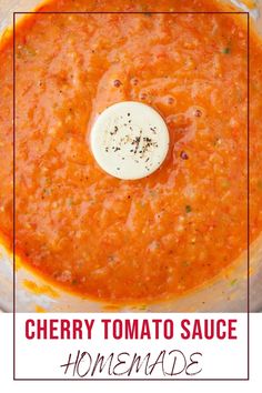 a food processor with tomato sauce in it and the words cherry tomato sauce on top