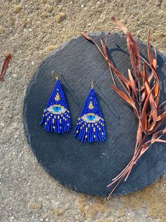 Blue Evil eye beaded fringe earrings seed bead earrings dangle boho earrings chandelier earrings native bead earrings evening earrings bohemian Dᴏ ʏᴏᴜ ʙᴇʟɪᴇᴠᴇ ɪɴ ᴛʜᴇ ᴇᴠɪʟ ᴇʏᴇ? Wᴇ ʙᴇʟɪᴇᴠᴇ! :) ♥𝑇ℎ𝑒 𝑝𝑎𝑡𝑡𝑒𝑟𝑛 𝑜𝑓 𝑡ℎ𝑖𝑠 𝑒𝑎𝑟𝑟𝑖𝑛𝑔 ℎ𝑎𝑠 𝑏𝑒𝑒𝑛 𝑐𝑟𝑒𝑎𝑡𝑒𝑑 𝑡𝑜 𝑝𝑟𝑜𝑡𝑒𝑐𝑡 𝑦𝑜𝑢 𝑓𝑟𝑜𝑚 𝑡ℎ𝑒 𝑒𝑣𝑖𝑙 𝑒𝑦𝑒 𝑎𝑛𝑑 𝑐𝑟𝑒𝑎𝑡𝑒𝑑 𝑏𝑦 𝐻𝑊𝐵𝑒𝑎𝑑𝐽𝑒𝑤𝑒𝑙𝑟𝑦.  ♥𝑀𝑎𝑑𝑒 𝑢𝑠𝑖𝑛𝑔 𝑓𝑟𝑒𝑒ℎ𝑎𝑛𝑑 𝑏𝑒𝑎𝑑𝑖𝑛𝑔 𝑤𝑜𝑣𝑒𝑛 𝑡𝑒𝑐ℎ𝑛𝑖𝑞𝑢𝑒𝑠 𝑤𝑖𝑡ℎ 𝑠𝑡𝑟𝑜𝑛𝑔 𝑠𝑦𝑛𝑡ℎ𝑒 Folk Art Beaded Earrings, Bohemian Evil Eye Dangle Jewelry, Blue Seed Bead Earrings, Evil Eye Beaded Earrings, Evening Earrings, Beaded Fringe Earrings, Chakra Beads, Earrings Chandelier, Beaded Earrings Patterns