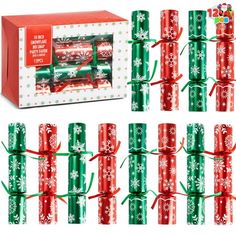 christmas crackers wrapped in green and red paper with snowflakes on the wrappers