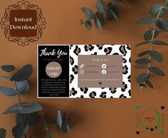 an image of thank you card with leaves on the table next to it and a plant