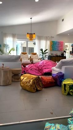 a living room filled with lots of colorful furniture