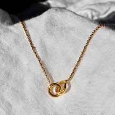 This gold necklace features two linked hoops, a modern and stylish design that's perfect for any occasion. It also makes the perfect gift for your partner in life (for both romantic or a friend). The connection of two perfect gold loops front and center is an expression of individuality while celebrating harmony. Our unity necklace is made from stainless steel material, meaning it is safe for water and sweat exposure without the risk of tarnishing. The necklace is 16" in length and has an additi