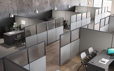 an office cubicle with multiple cubicles and desks