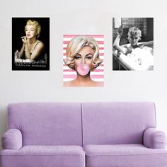 three marilyn monroe pictures hang on the wall above a purple couch