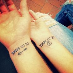 two people with matching tattoos on their arms