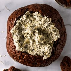 a chocolate cake with cream cheese on top