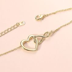 ✦ Show your eternal love with the Infinity Heart Pendant Necklace! No matter the relationship, this exquisite necklace celebrates the endless joy of love. The heart and infinity symbols combined represent never-ending devotion, while the inlaid clear zircon signifies purity and tranquility. Always express your unwavering love for your special someone with this stunning necklace. ----------- DETAILS ----------- - Materials: 925 Sterling Silver, Cubic Zirconia - Necklace Length: 40cm + 5cm - Pendant Size: 0.6*0.9cm - SKU:YS127 Valentine's Day Jewelry With Adjustable Chain For Anniversary, Adjustable Chain Jewelry For Anniversary And Valentine's Day, Adjustable Double Heart Jewelry For Anniversary Gift, White Gold Infinity Jewelry For Anniversary Gift, Mother's Day Infinity Jewelry With Adjustable Chain, Infinity Jewelry For Mother's Day, Infinity Cubic Zirconia Necklace For Mother's Day, Mother's Day Infinity Necklace With Cubic Zirconia, Mother's Day Cubic Zirconia Infinity Necklace