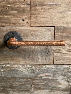 an old door handle on a wooden door