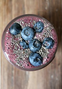 a smoothie topped with blueberries and chia seeds